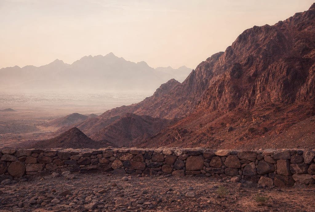 The reddish slopes of Mount Uhud in early morning haze